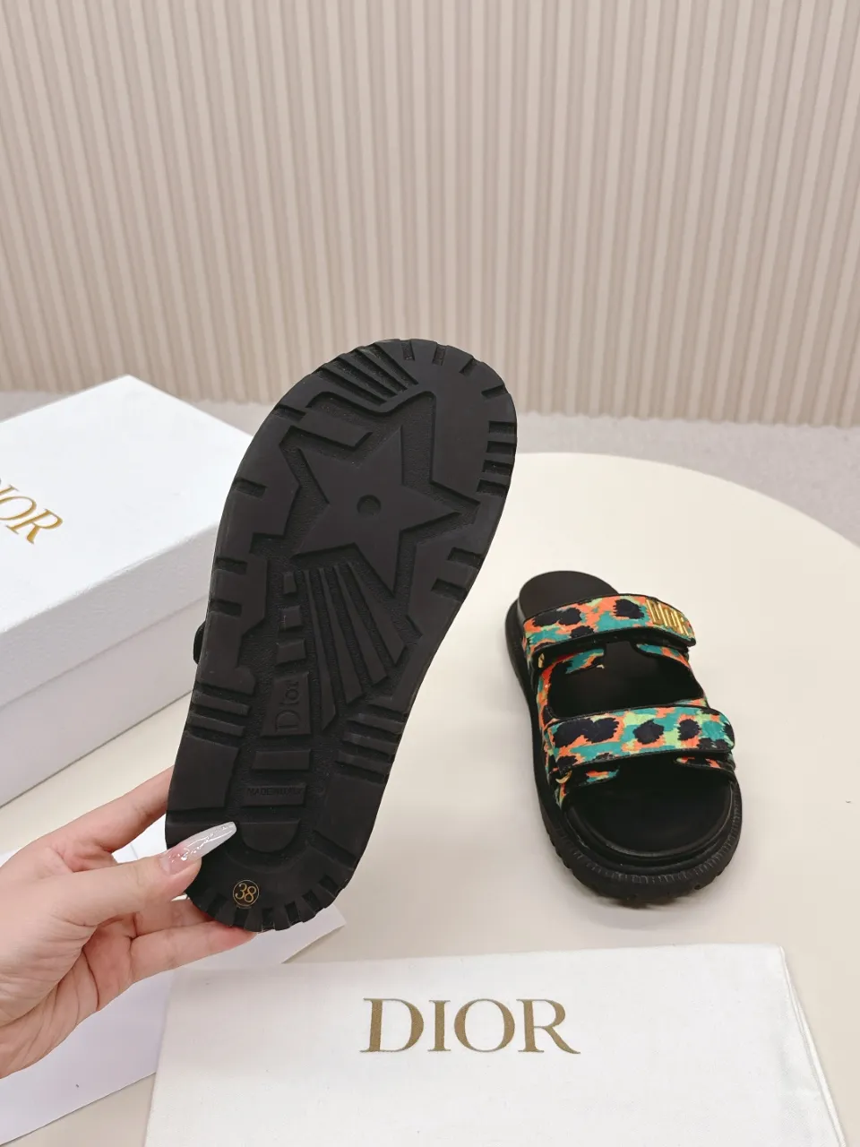 👟👟Ex-factory price 460👟👟 This black sheepskin DiorAct sandal is fashionable. Paired with an insole that fits the shape of your foot, it's made of exceptionally lightweight and comfortable leather. The upper straps feature a Velcro closure and feature a gold-finish metal "DIOR" logo. Can be matched with various styles to show modern style. Gold-finish metal "DIOR" logo Two adjustable Velcro straps Leather insole that fits the shape of your foot Soft and lightweight texture EVA sole decorated with Christian Dior's lucky star symbol Made in Italy Size 35--42 (Customized sizes 41 and 42 are non-refundable)